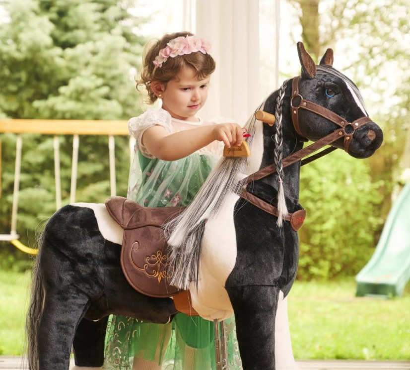 Cheval à roulettes inline Ponnie Domino M avec une selle rose