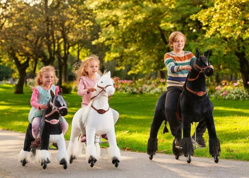 Small horse on wheels Ponnie Domino S with pink saddle