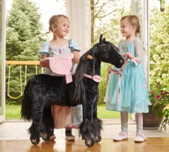 Cheval à roulettes inline Ponnie Ebony S avec une selle rose