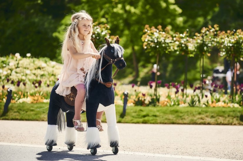 Black-and-white mechanical riding horse Ponnie Domino M | Ponnie