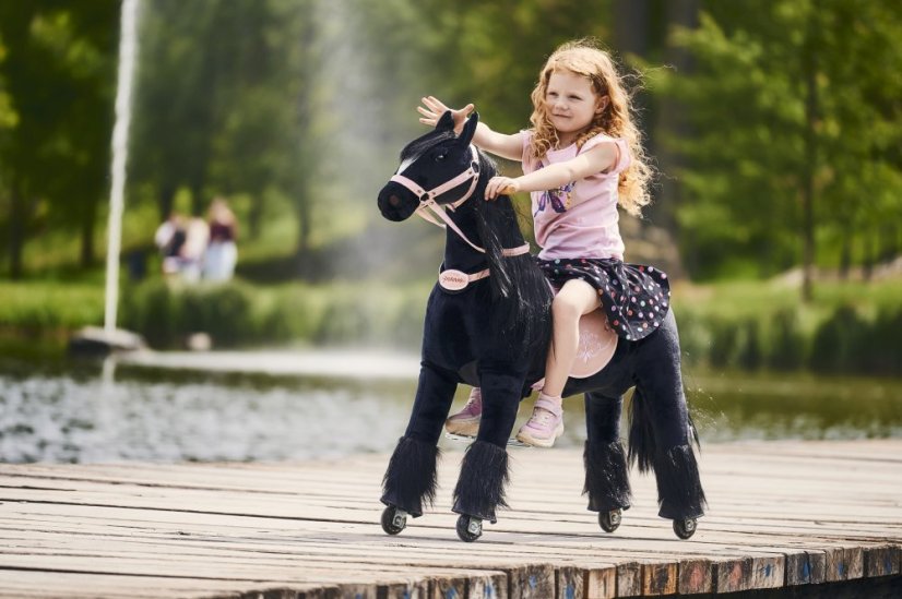 Mechanical riding horse Ponnie Ebony M with pink saddle
