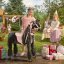 Mechanical riding horse Ponnie Ebony M with pink saddle