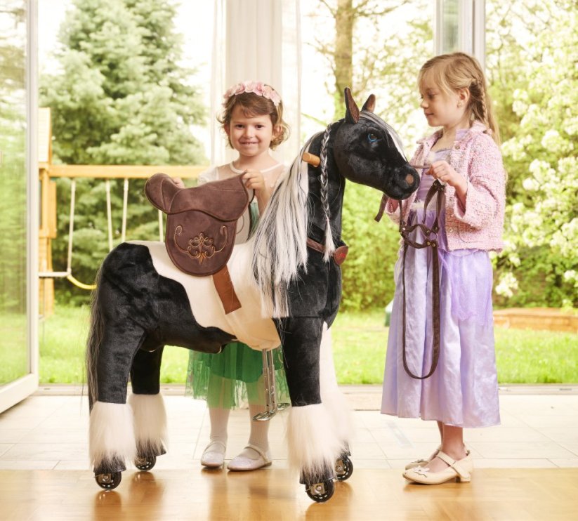Mechanical riding horse Ponnie Domino M with pink saddle